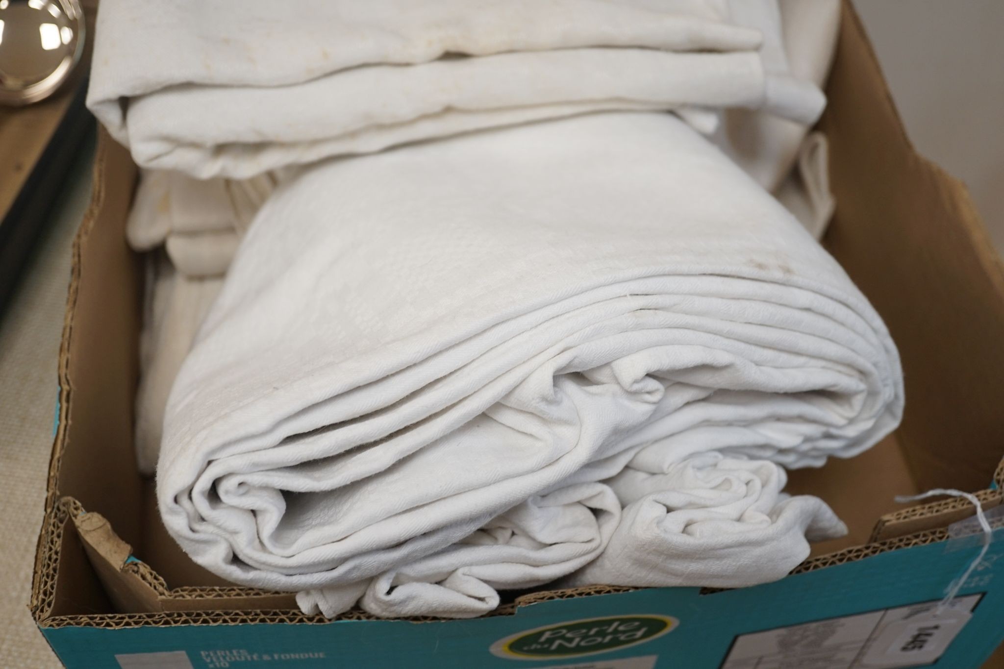 Two French provincial thick linen monogrammed tablecloths and three others.